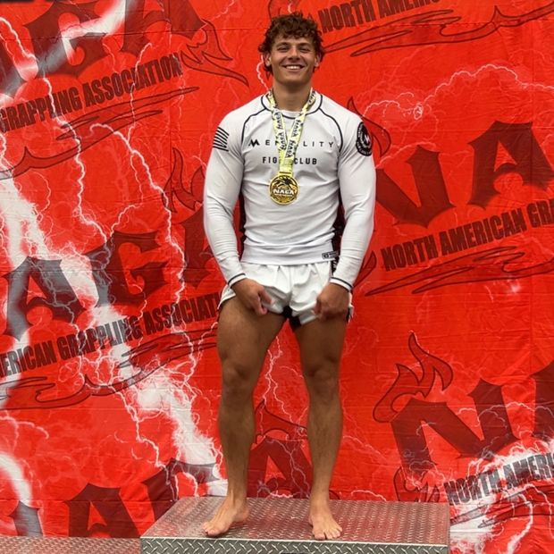 CJ Fazio on the podium with a NAGA gold medal
