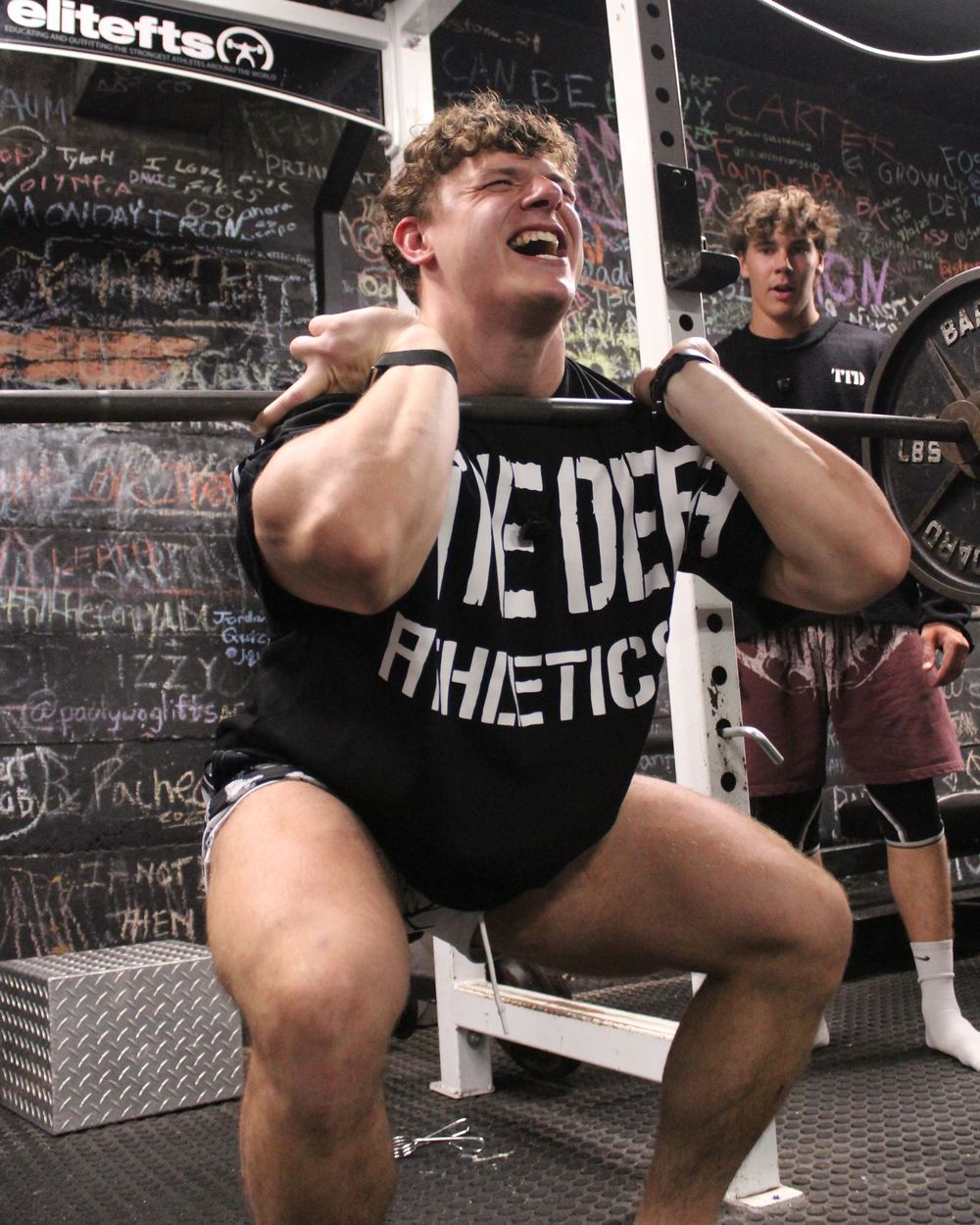 CJ Fazio front squatting