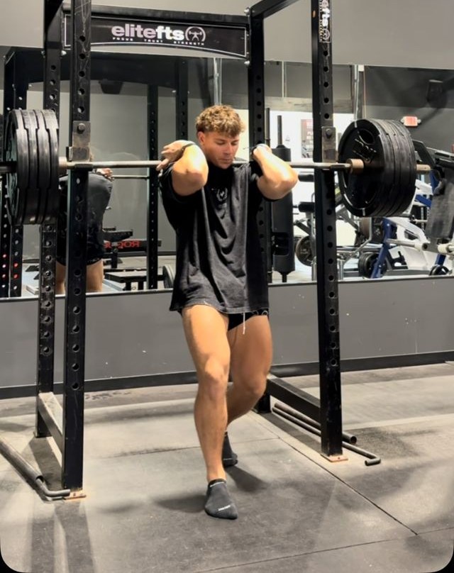 CJ Fazio front squatting